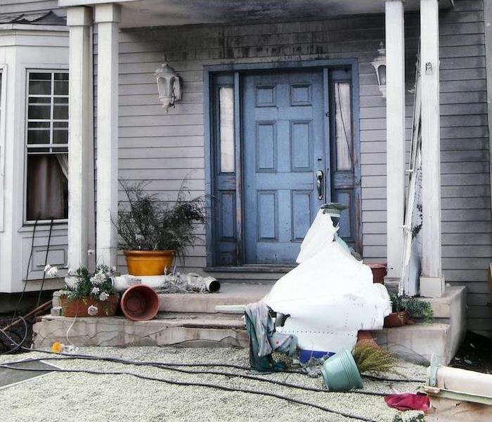 front porch of residential property in need of repairs, restoration and deep cleaning